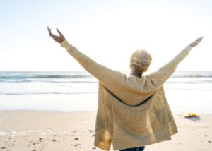 Retired woman on beach